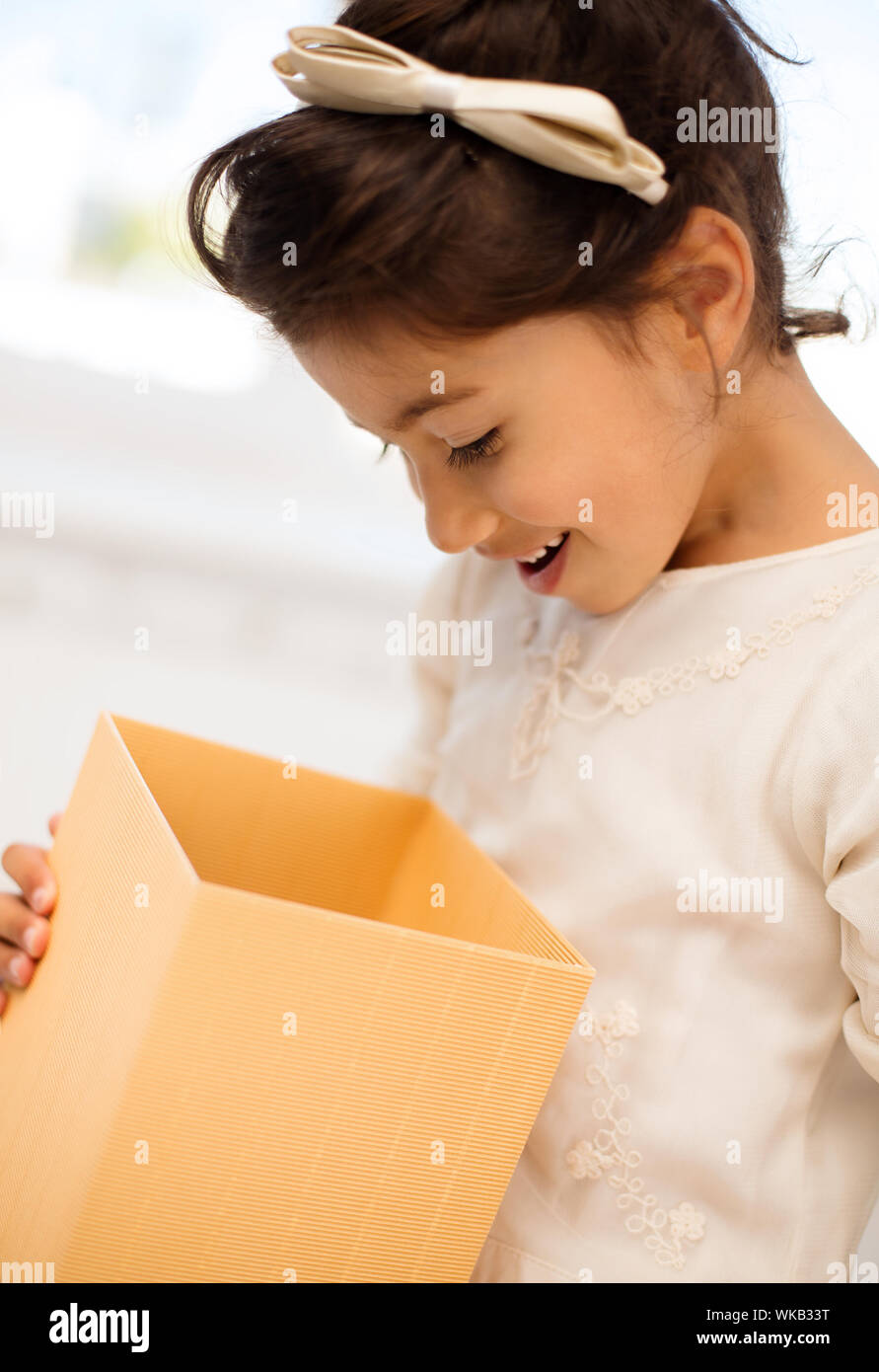 holidays, presents, christmas, x-mas, birthday concept - happy child ...