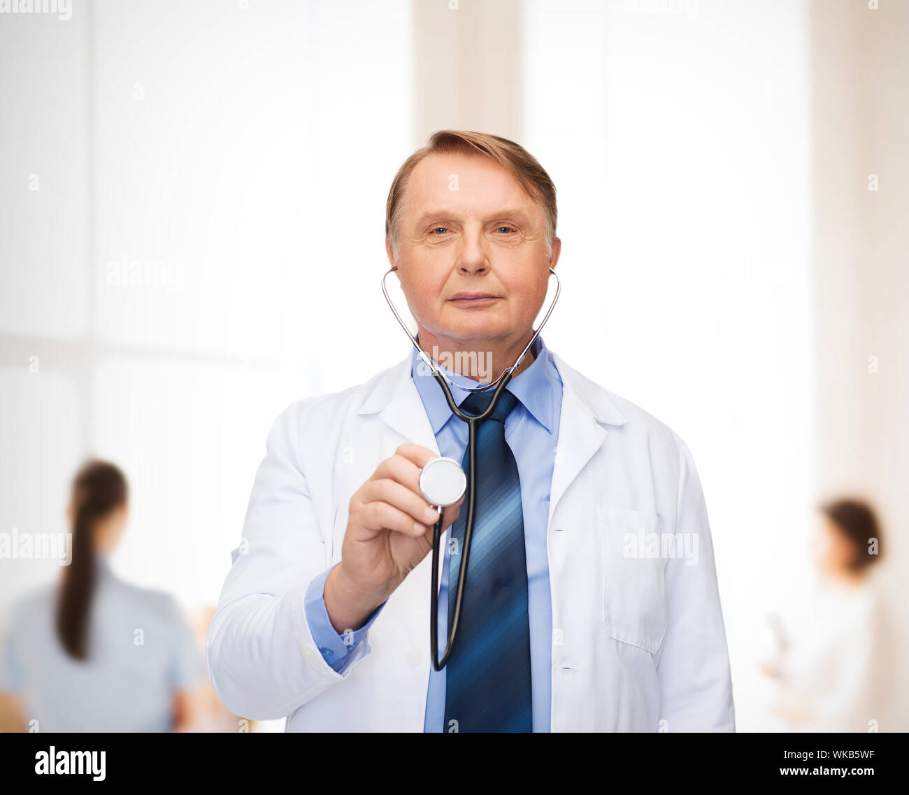 healthcare and medicine concept smiling standing doctor or professor