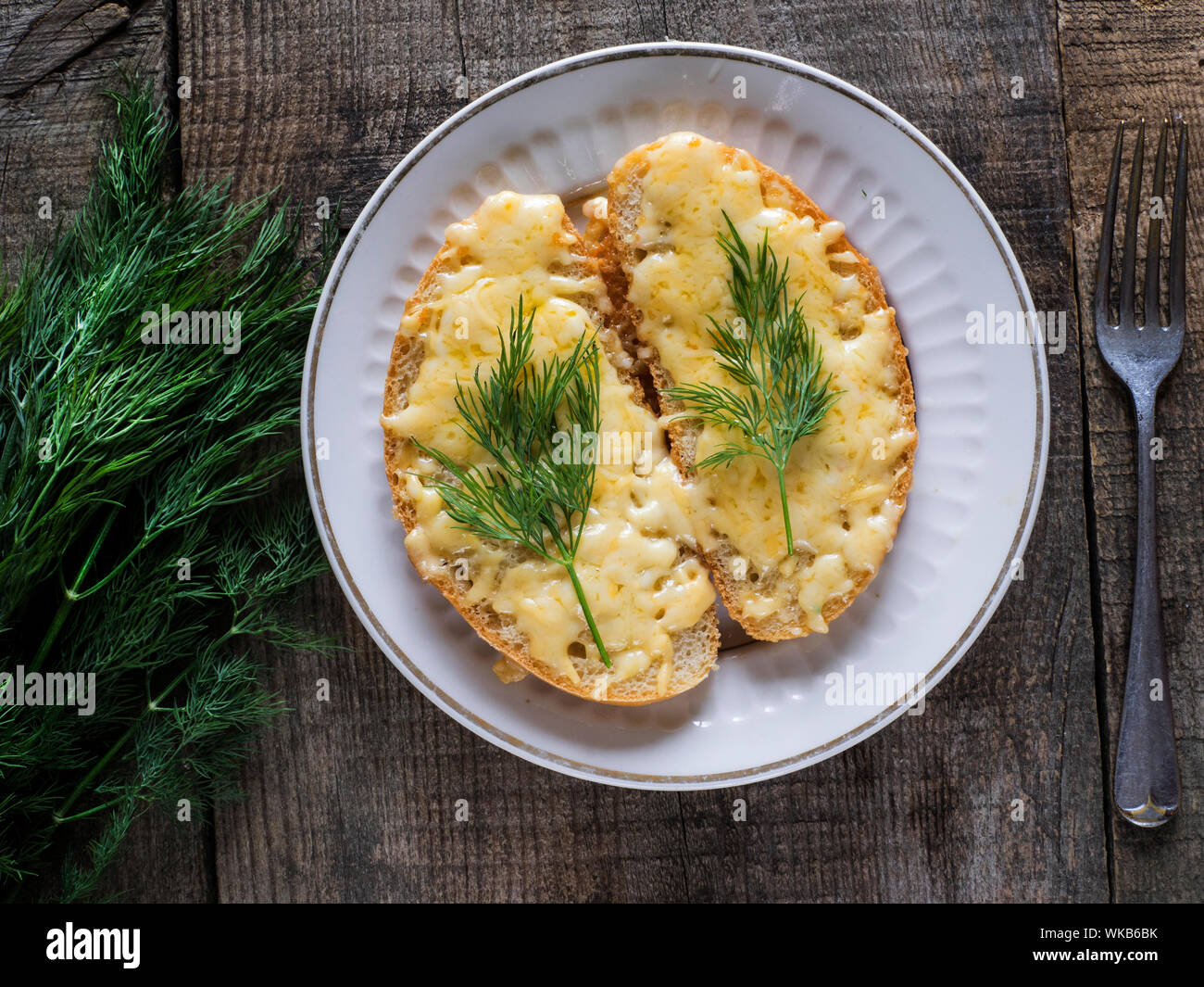 Cheese Melten On Bread With Dill Stock Photo