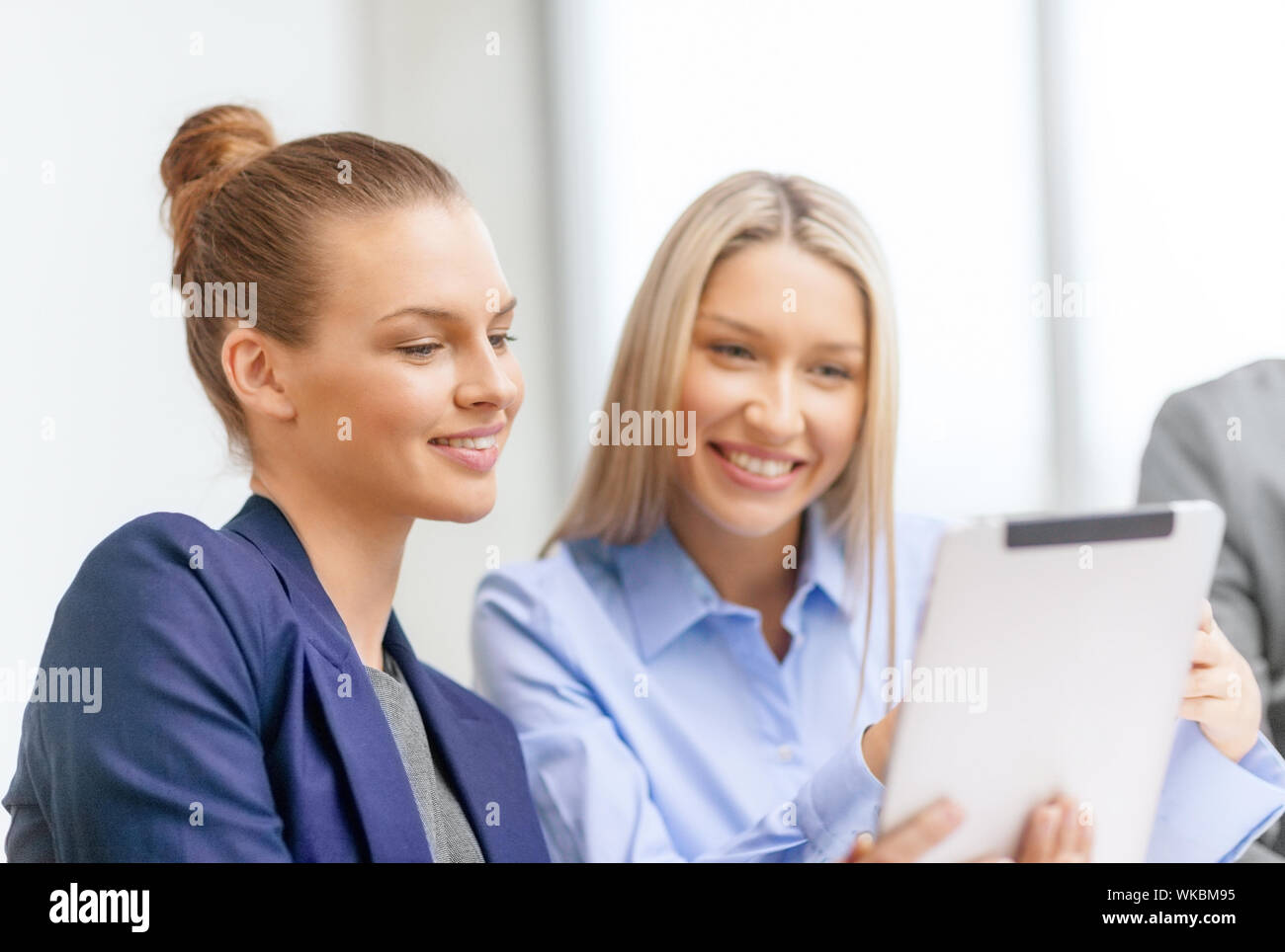 business team with tablet pc having discussion Stock Photo