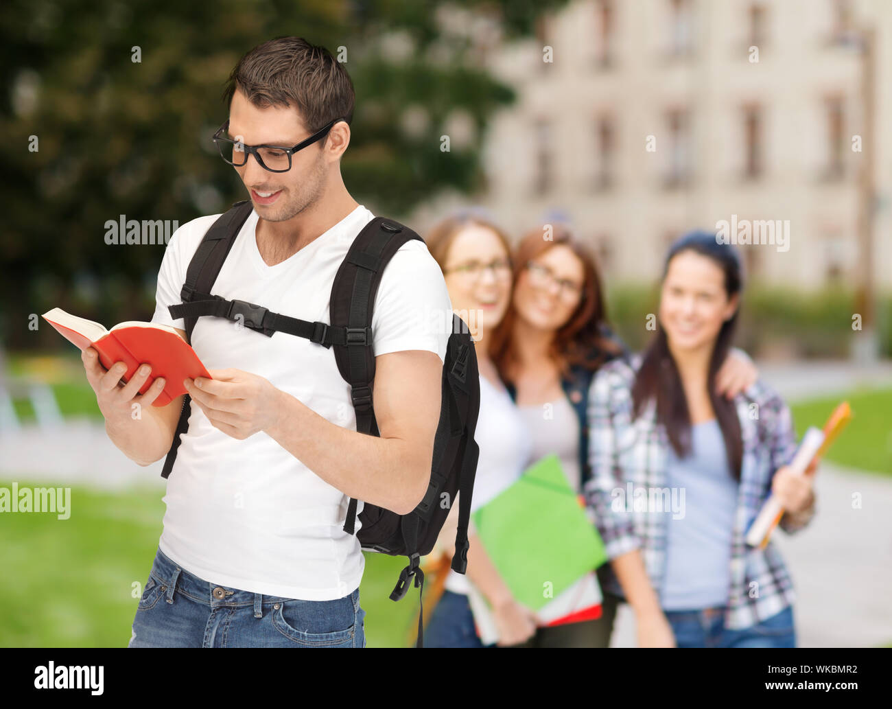 travelling student with backpack and book Stock Photo