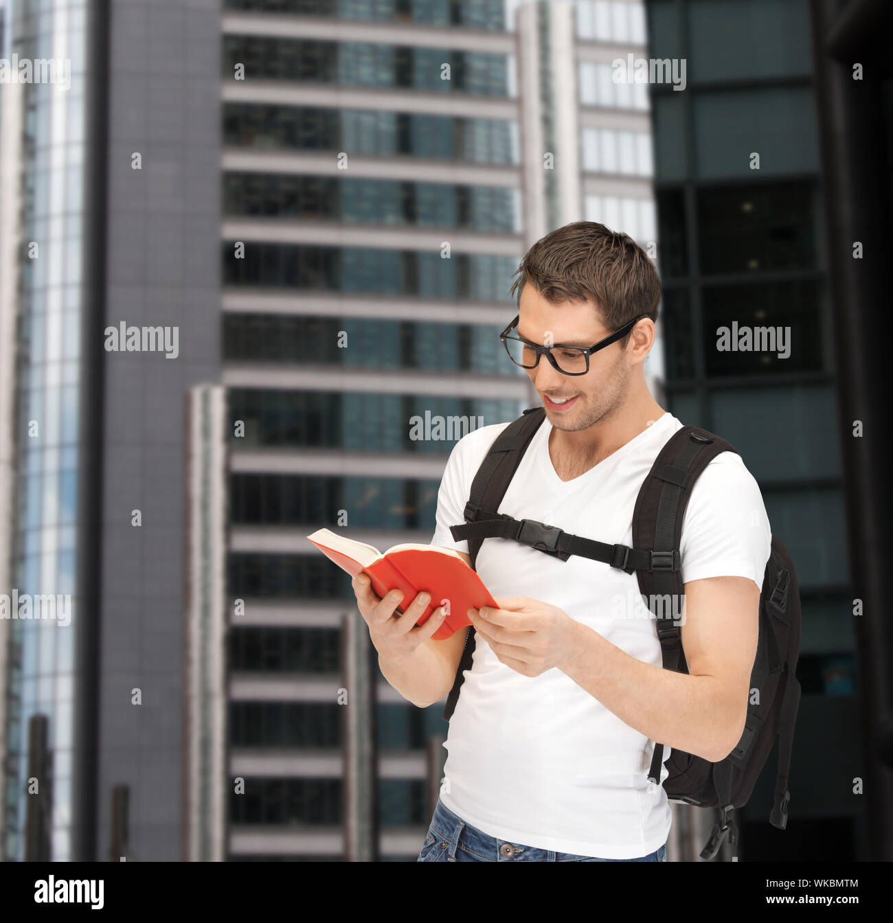 student in eyeglasses with backpack and book Stock Photo