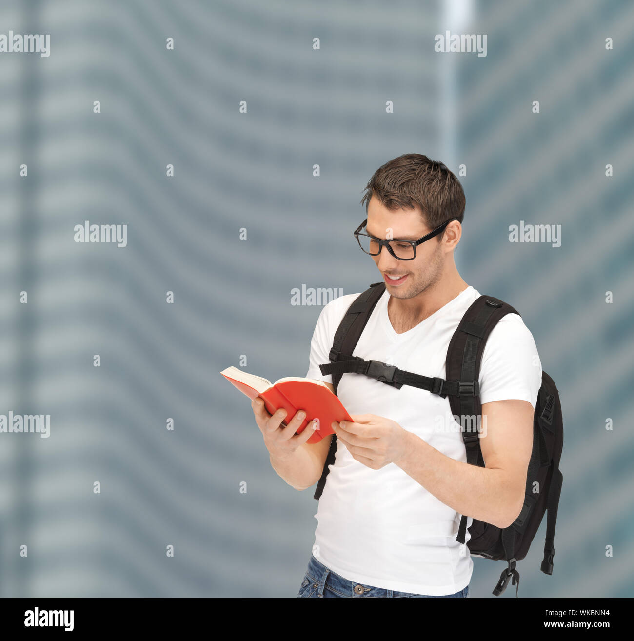 student in eyeglasses with backpack and book Stock Photo