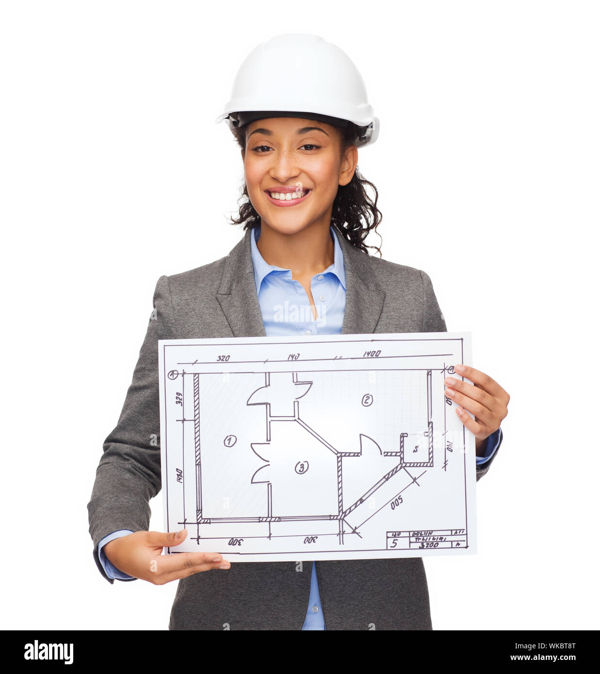building, developing, consrtuction and architecture concept - smiling businesswoman in white helmet showing blueprint Stock Photo