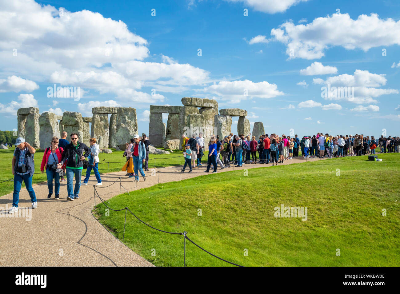 Crowds at Stonehenge stone circle stonehenge near Amesbury Wiltshire england uk gb Europe Stock Photo