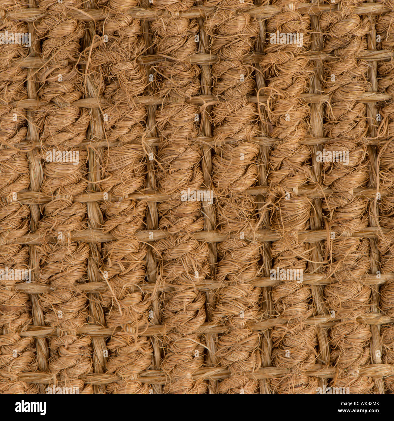 Closeup detail of a brown sisal carpet texture background Stock Photo