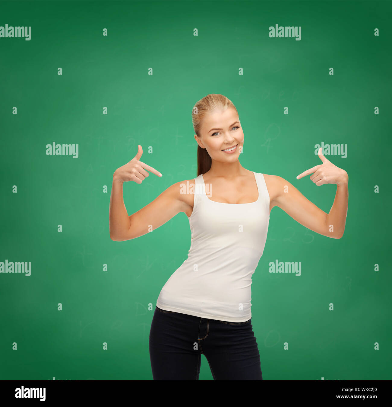 woman in blank white tshirt pointing at herself Stock Photo Alamy
