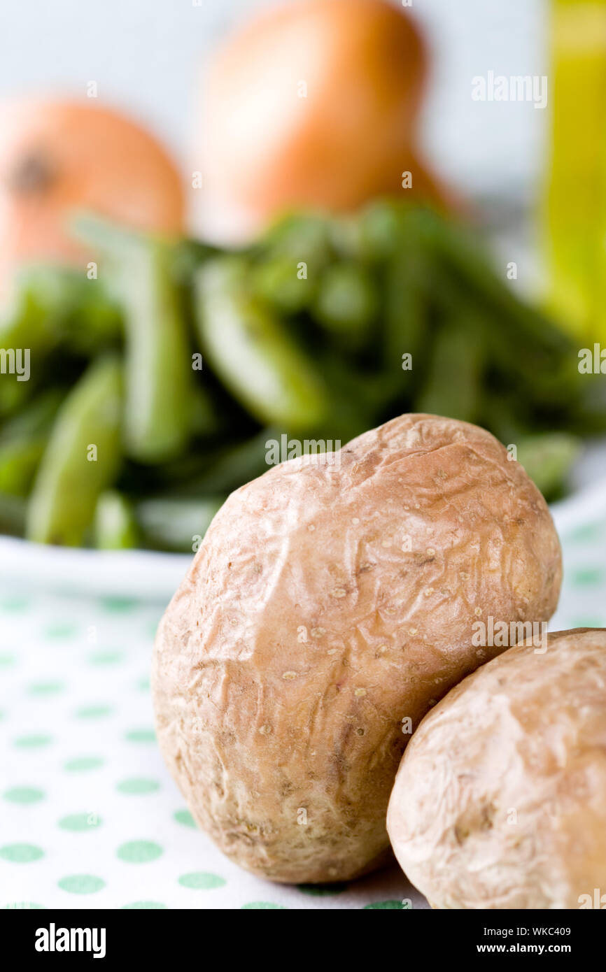 baked potatoes and french beans closeup on textile Stock Photo Alamy