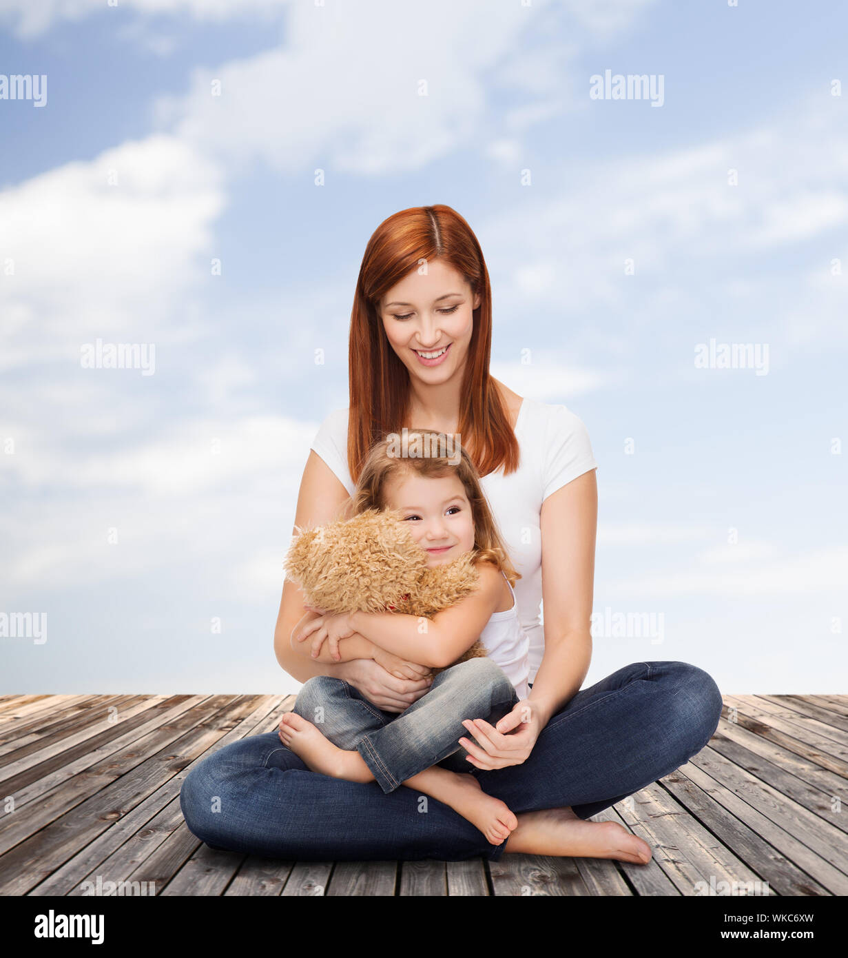 happy mother with adorable girl and teddy bear Stock Photo - Alamy