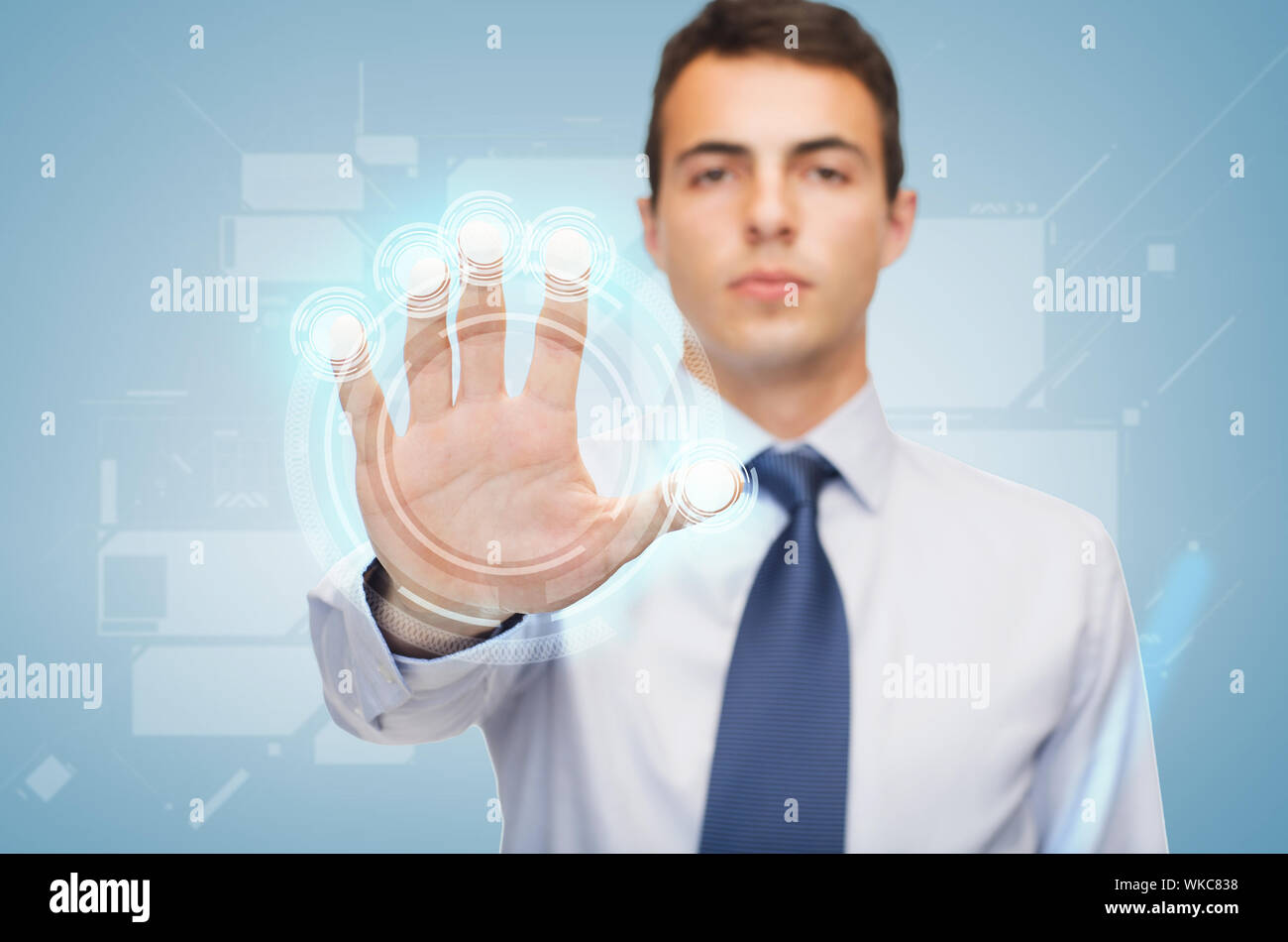 attractive buisnessman working with virtual screen Stock Photo