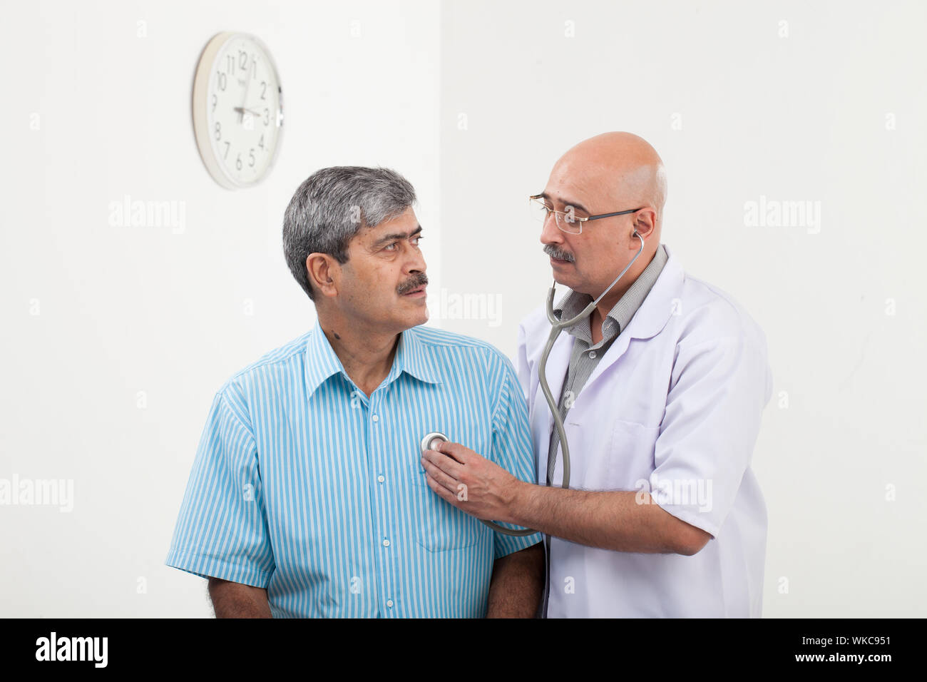 Indian male doctor examining hi-res stock photography and images - Alamy