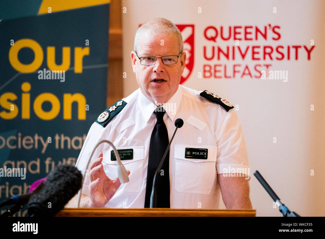 PSNI chief constable Simon Byrne speaks at the Patten 20 Years On: Young People, Policing and Stop and Search conference, in the Great Hall of Queen's University Belfast. Stock Photo