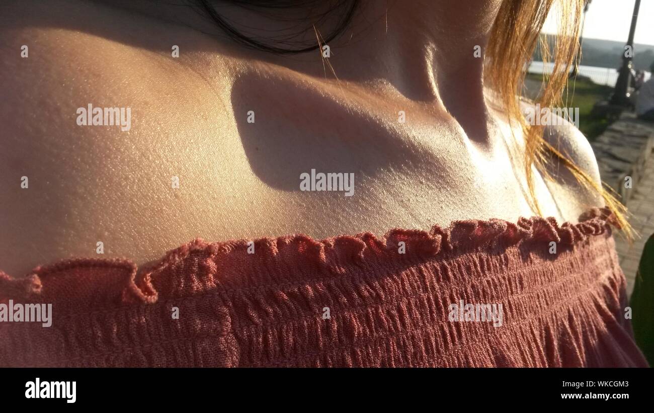 Midsection Of Woman Wearing Off Shoulder Top Stock Photo