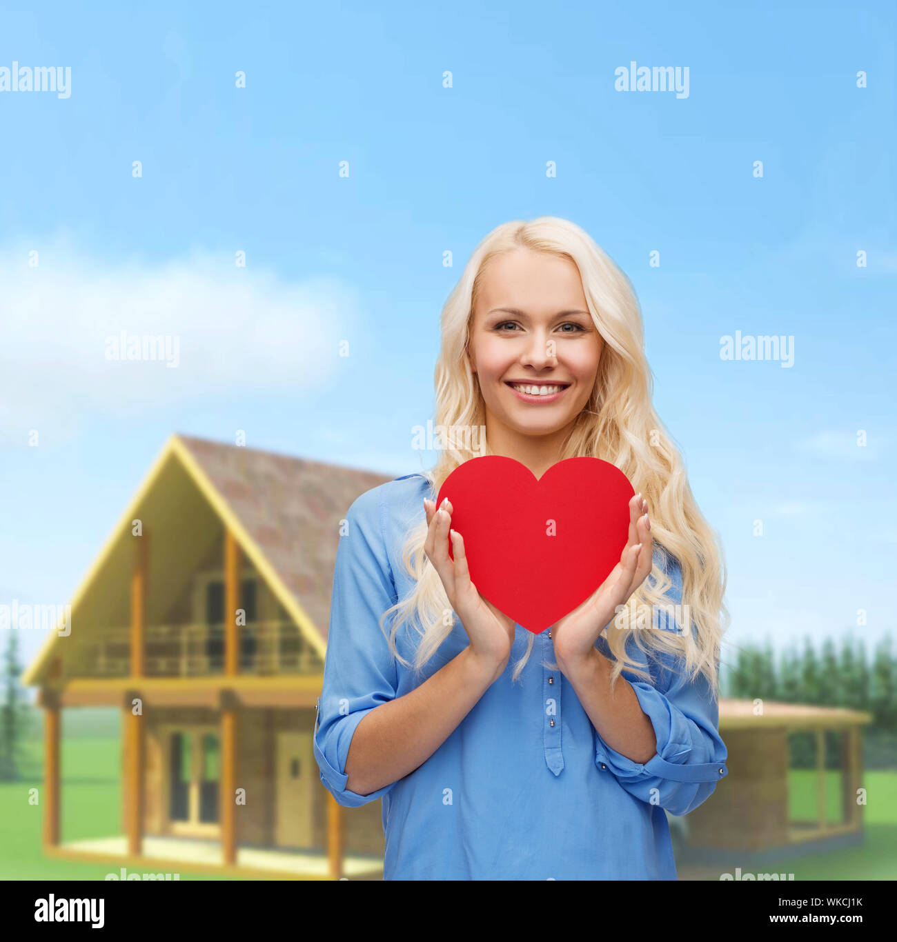 happiness, health and love concept - smiling woman with red heart Stock ...