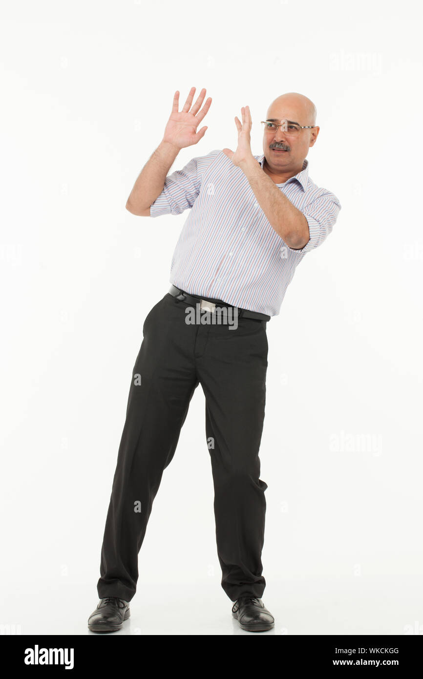 Businessman defending himself Stock Photo Alamy Businessman defending himself Stock Photo Alamy