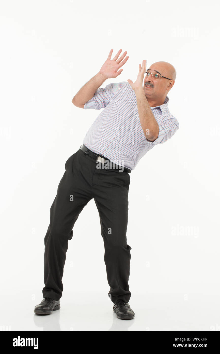 Businessman defending himself Stock Photo Alamy Businessman defending himself Stock Photo Alamy