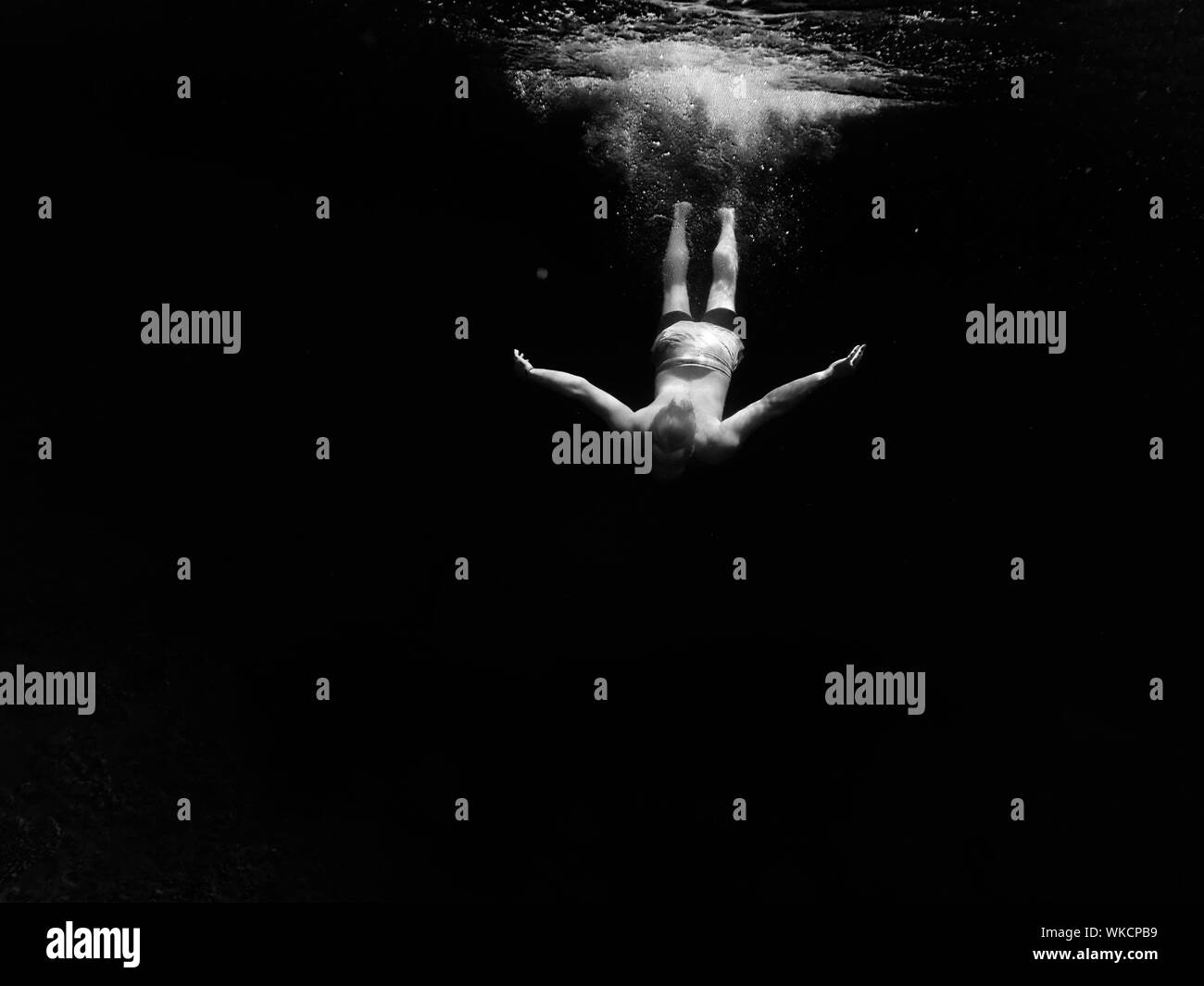 Man diving into water Black and White Stock Photos & Images - Alamy