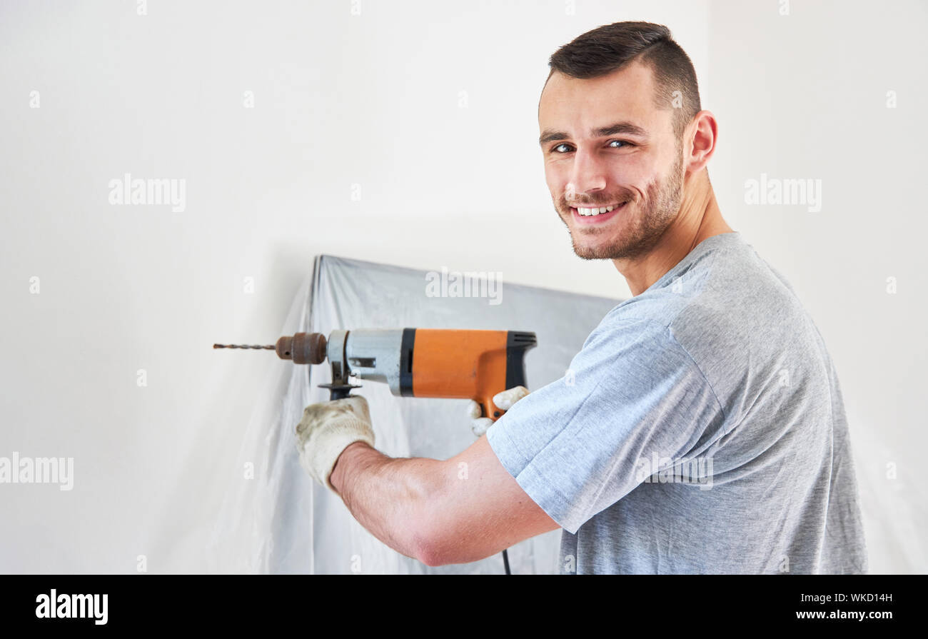 Drilling A Hole In The Wall With A Drill Stock Photo - Download Image Now -  Color Image, Craft, Drill - iStock