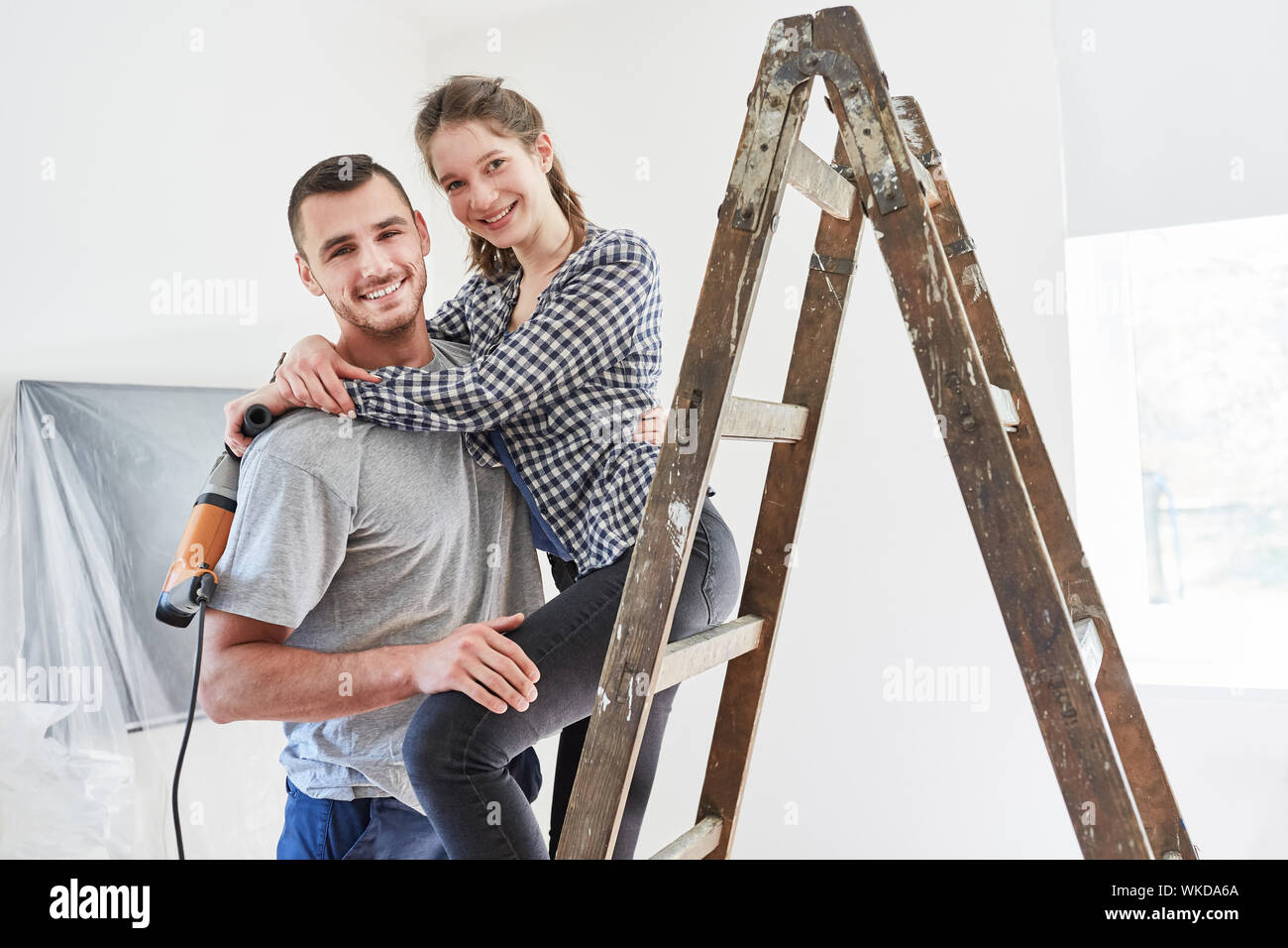 Happy couple together as home improvement during renovation of a house Stock Photo