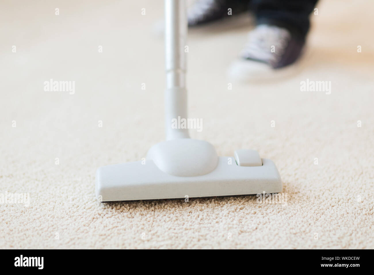 close up of male hoovering carpet Stock Photo Alamy