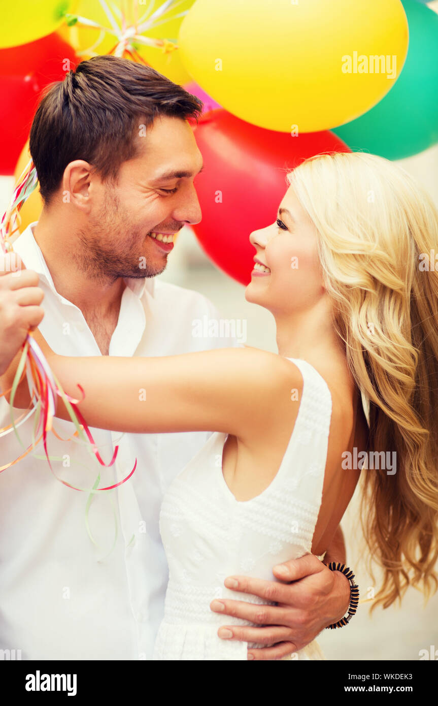 couple with colorful balloons kissing in the park Stock Photo - Alamy