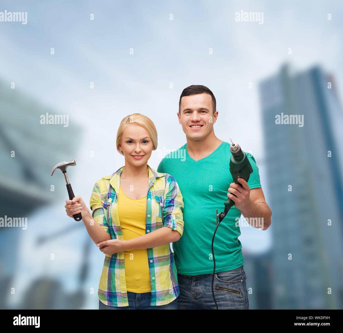 repair, construction and maintenance concept smiling couple with