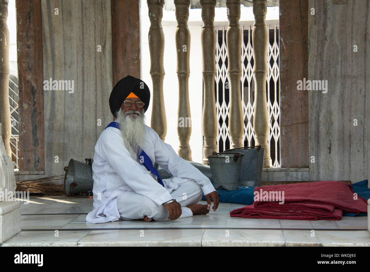 Old man sitting in Gurudwara, Gurudwara Bangla Sahib, New Delhi, India Stock Photo