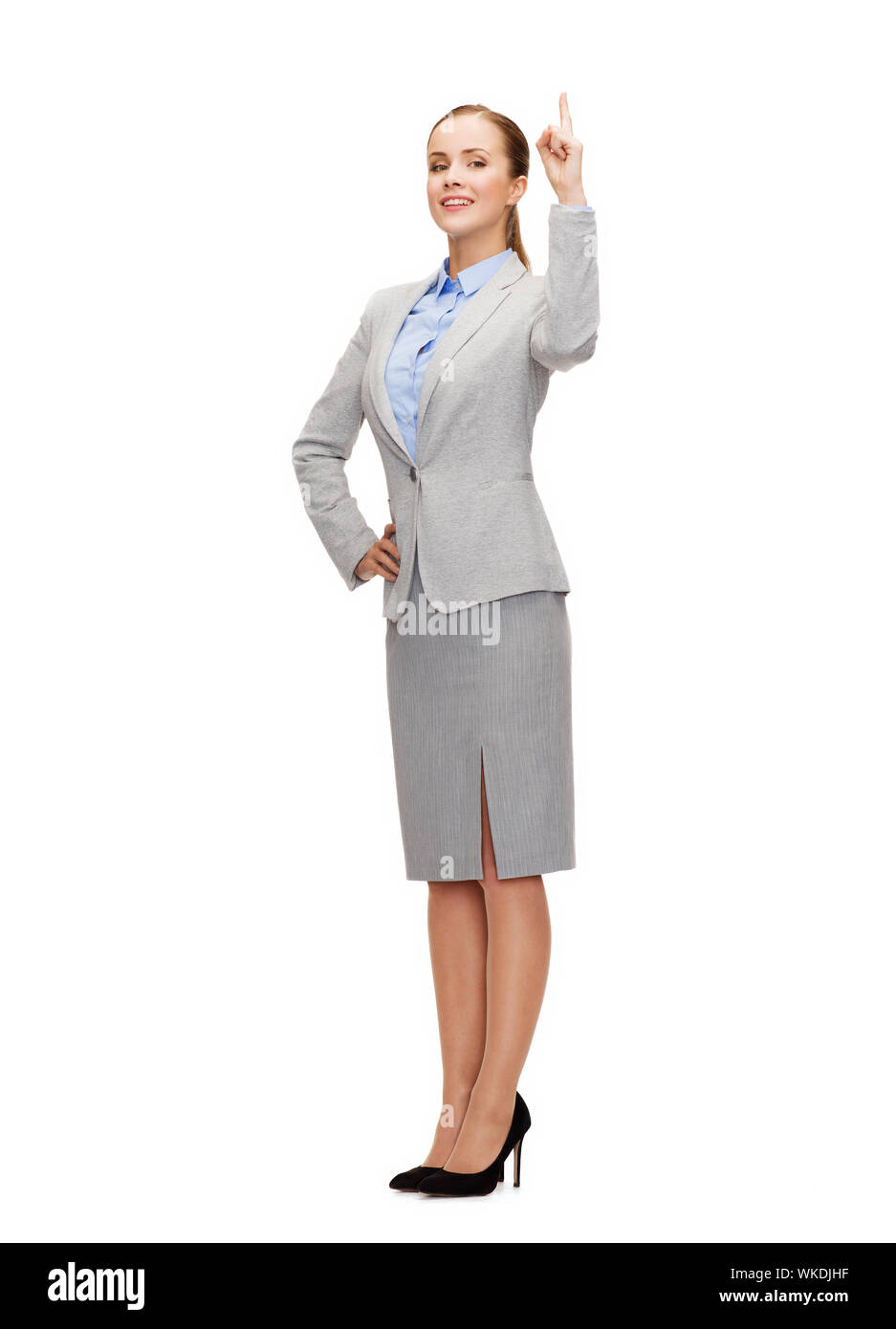 business and education concept - attractive young businesswoman with her finger up Stock Photo