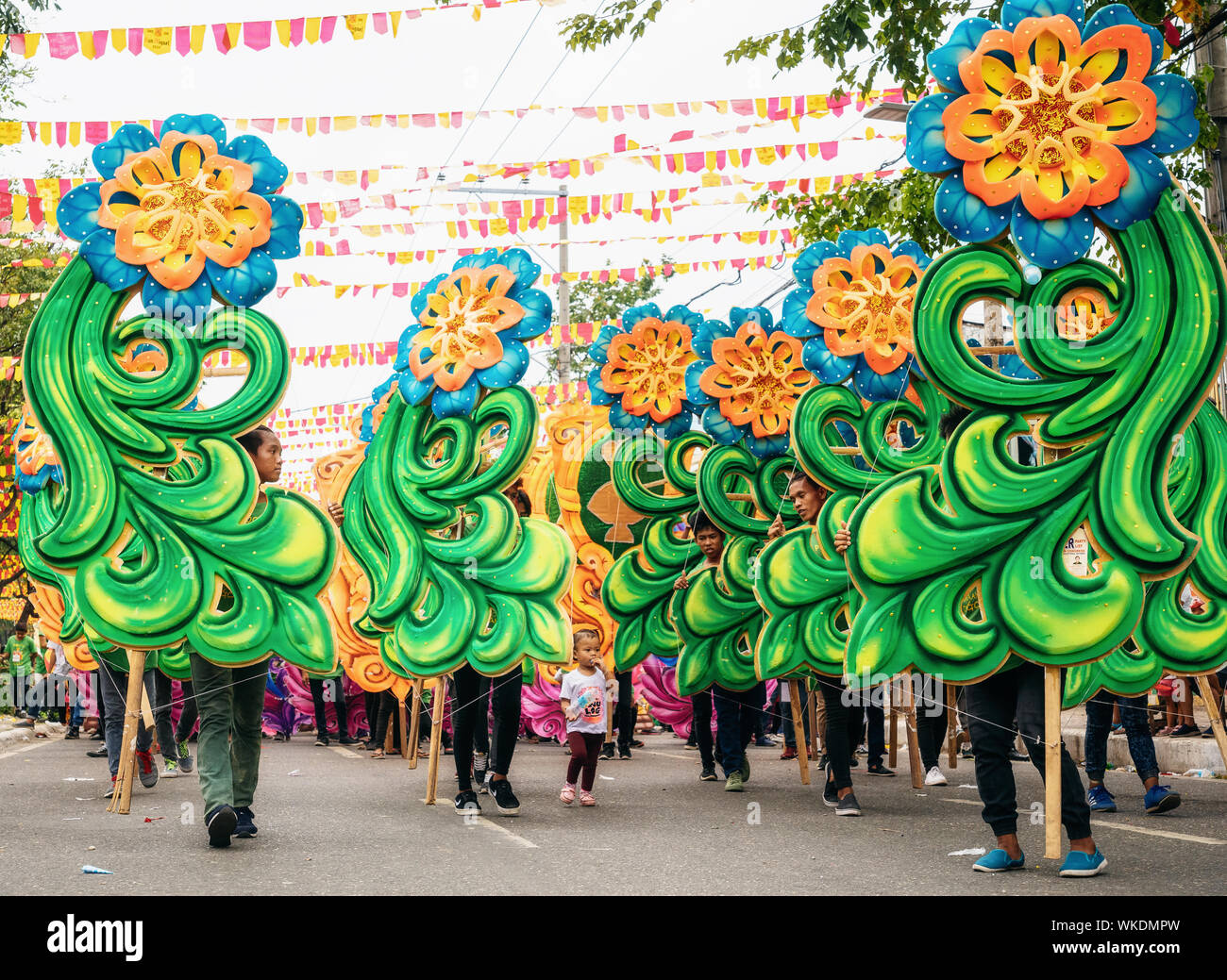 Cebu City , The Philippines - January 20, 2019: Street dancers in vivid colorful costumes participate in the parade at the Sinulog Festival. Stock Photo