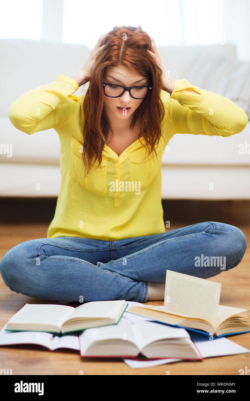 smiling student girl reading books at home Stock Photo - Alamy