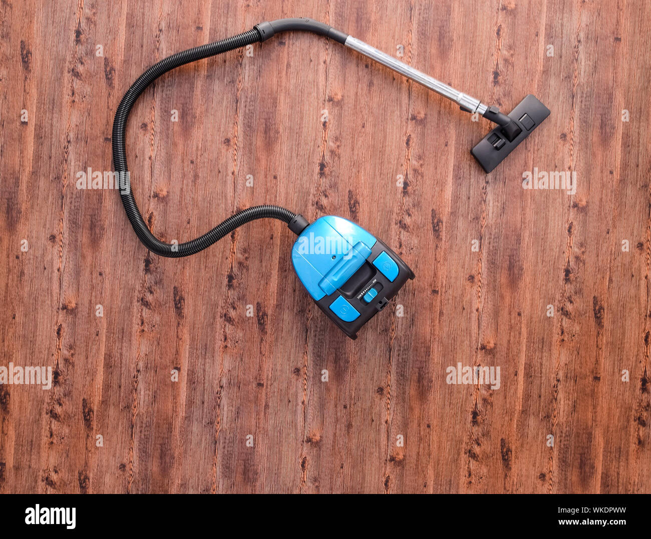 Vacuum Cleaner On The Floor In The Room Top View Stock Photo