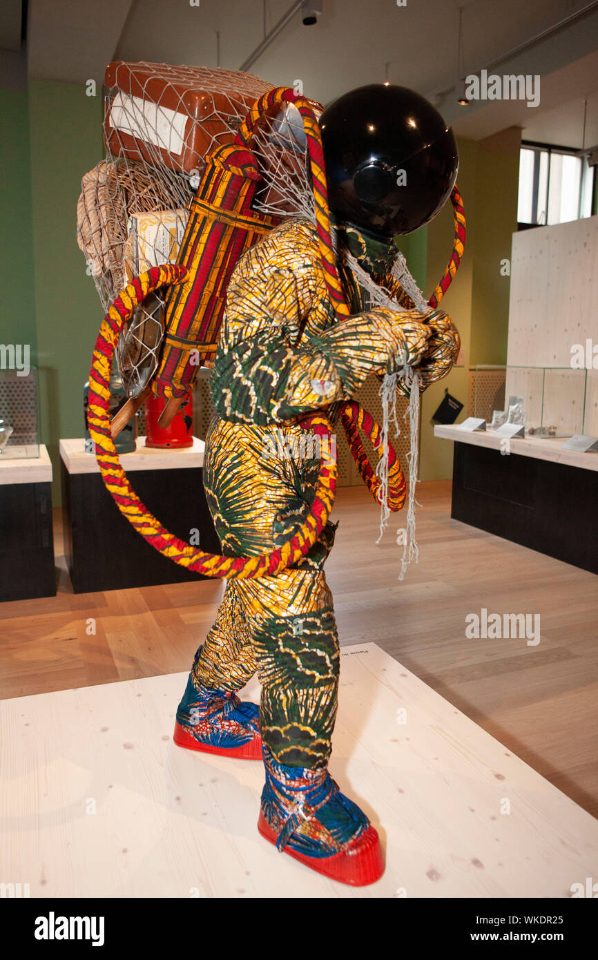 'Being Human', the new permanent display at London's Wellcome Collection includes sections on Genetics, Infection, Minds & Bodies and Environmental Breakdown. The collection of science displays and artworks includes 'Refugee Astronaut III' by Yinka Shonibare (2019). Stock Photo