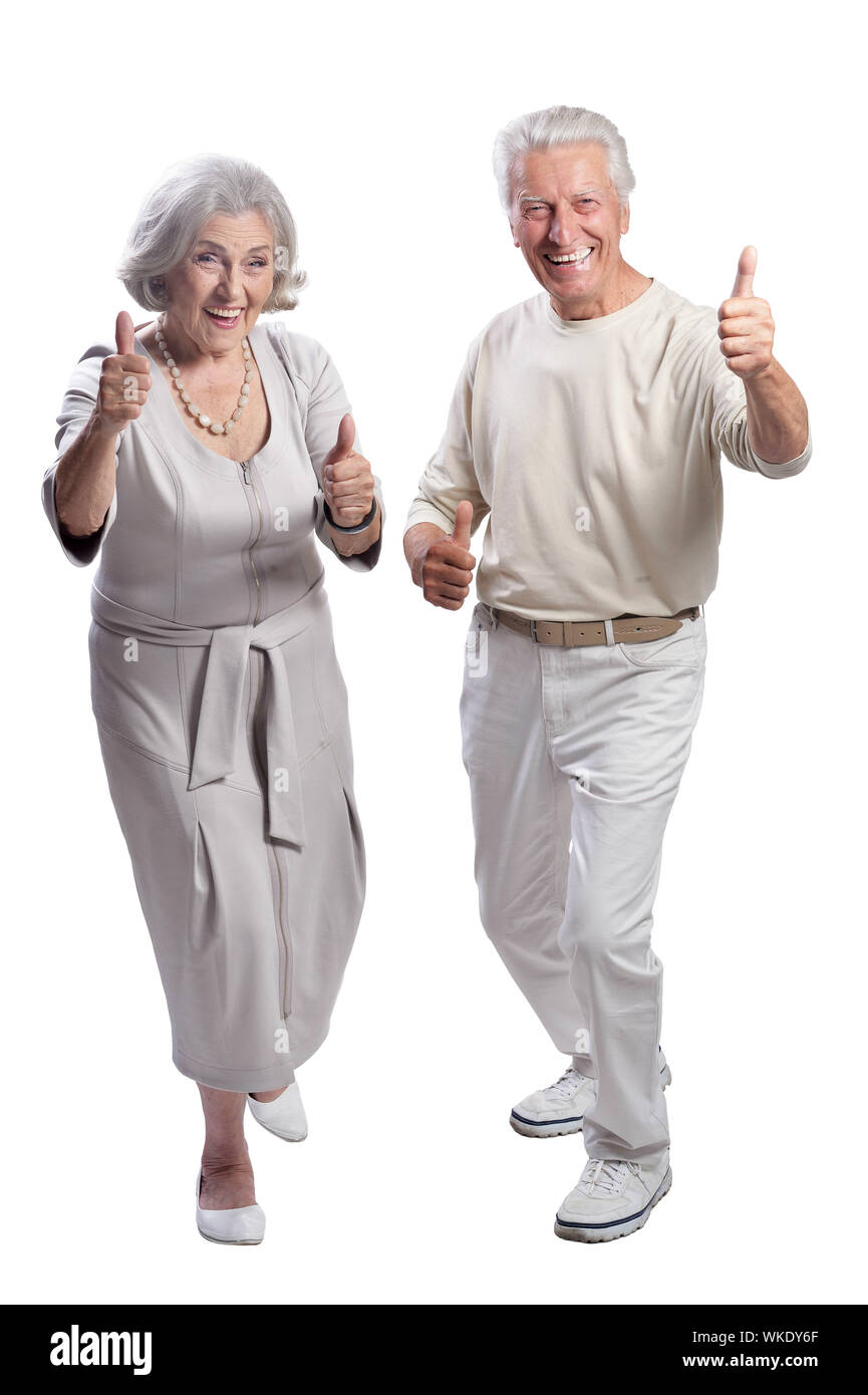 happy senior couple with thumbs up on white background Stock Photo - Alamy