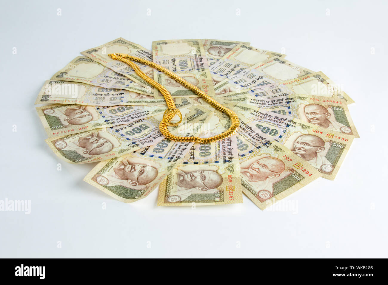 chain and ring on banknotes representing gold Loan concept Stock Photo ...