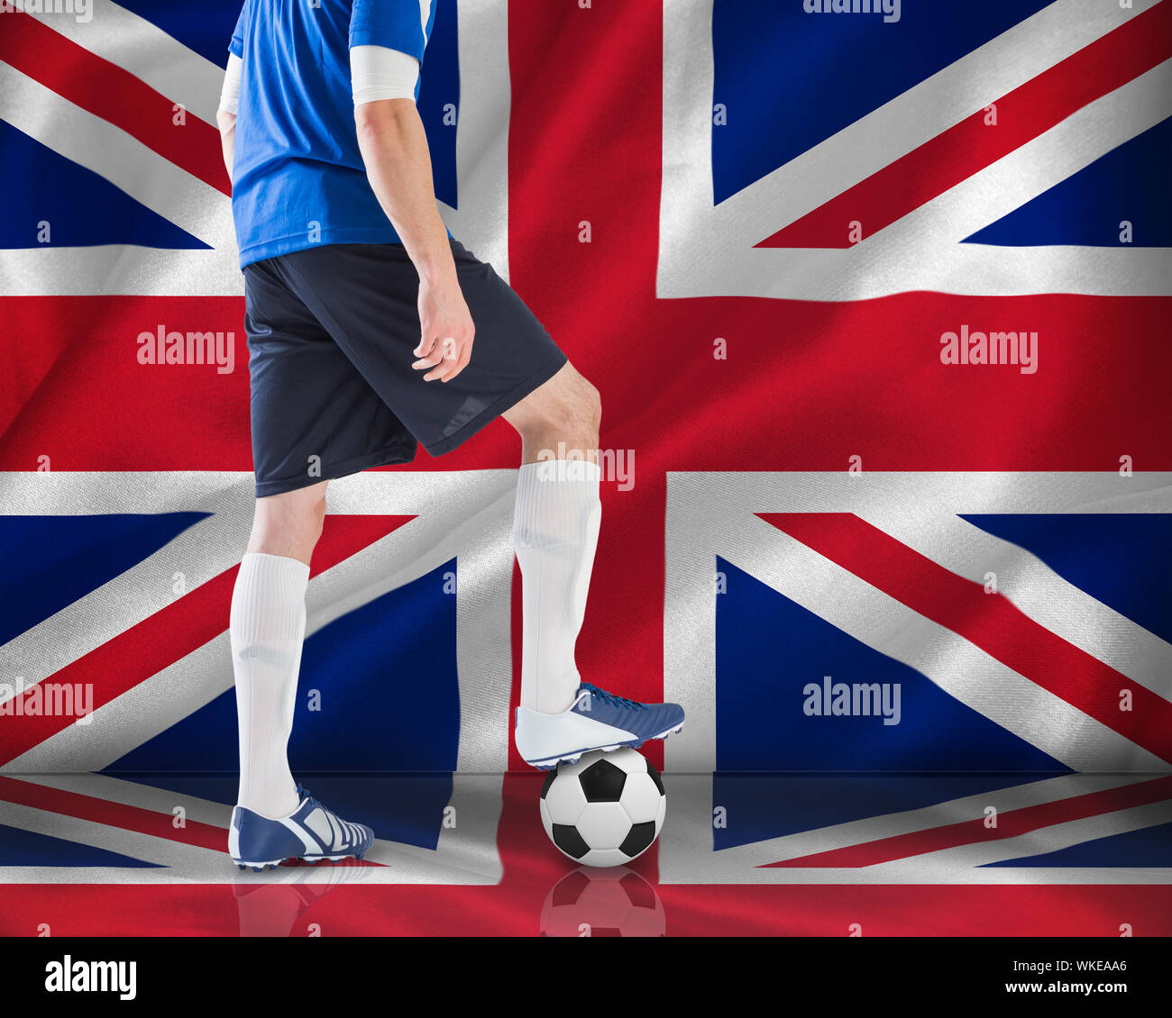 Football player in blue jersey against digitally generated uk national flag Stock Photo - Alamy