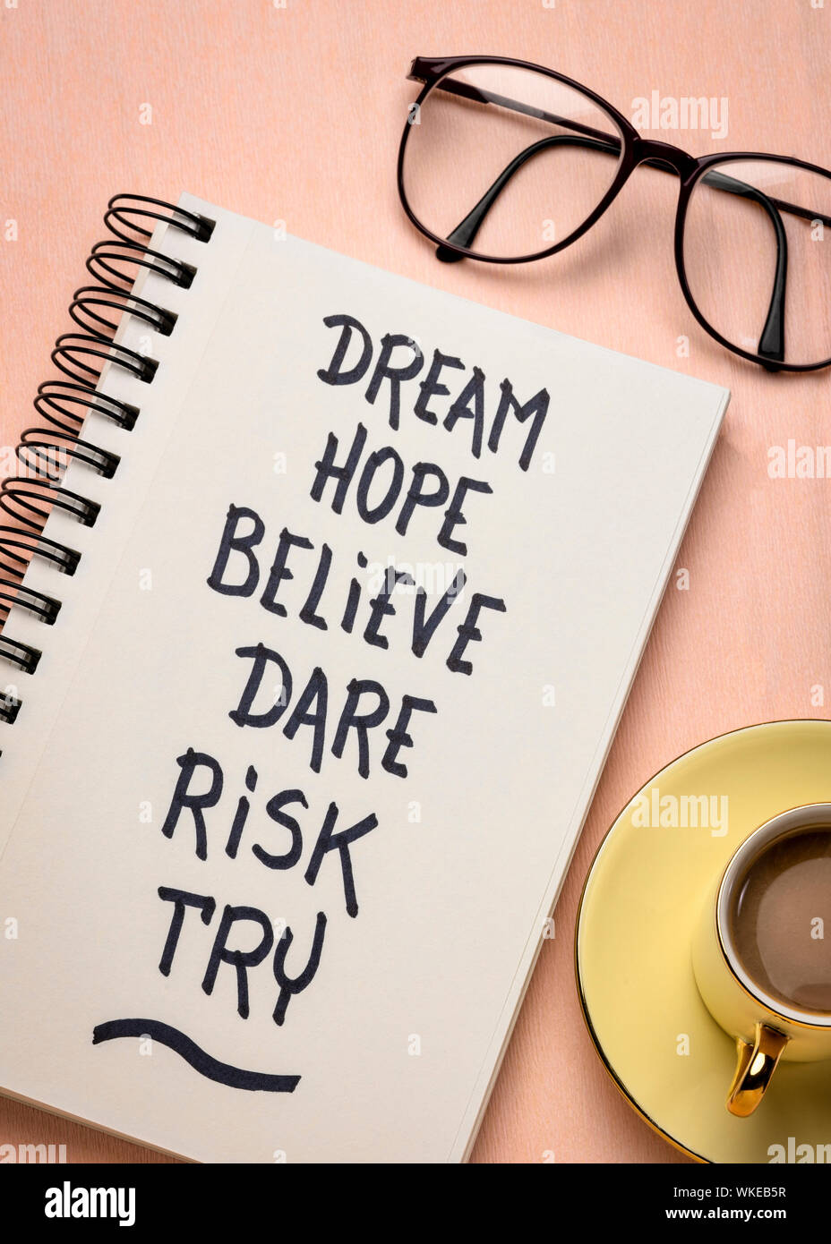 dream, hope, believe, dare, risk, try - creativity, inspirational and motivational concept, personal development,  -  handwriting in a spiral notebook Stock Photo