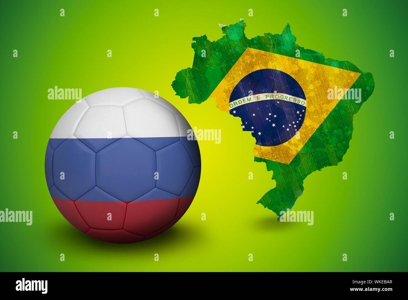Football in russia colours against green brazil outline with flag Stock Photo