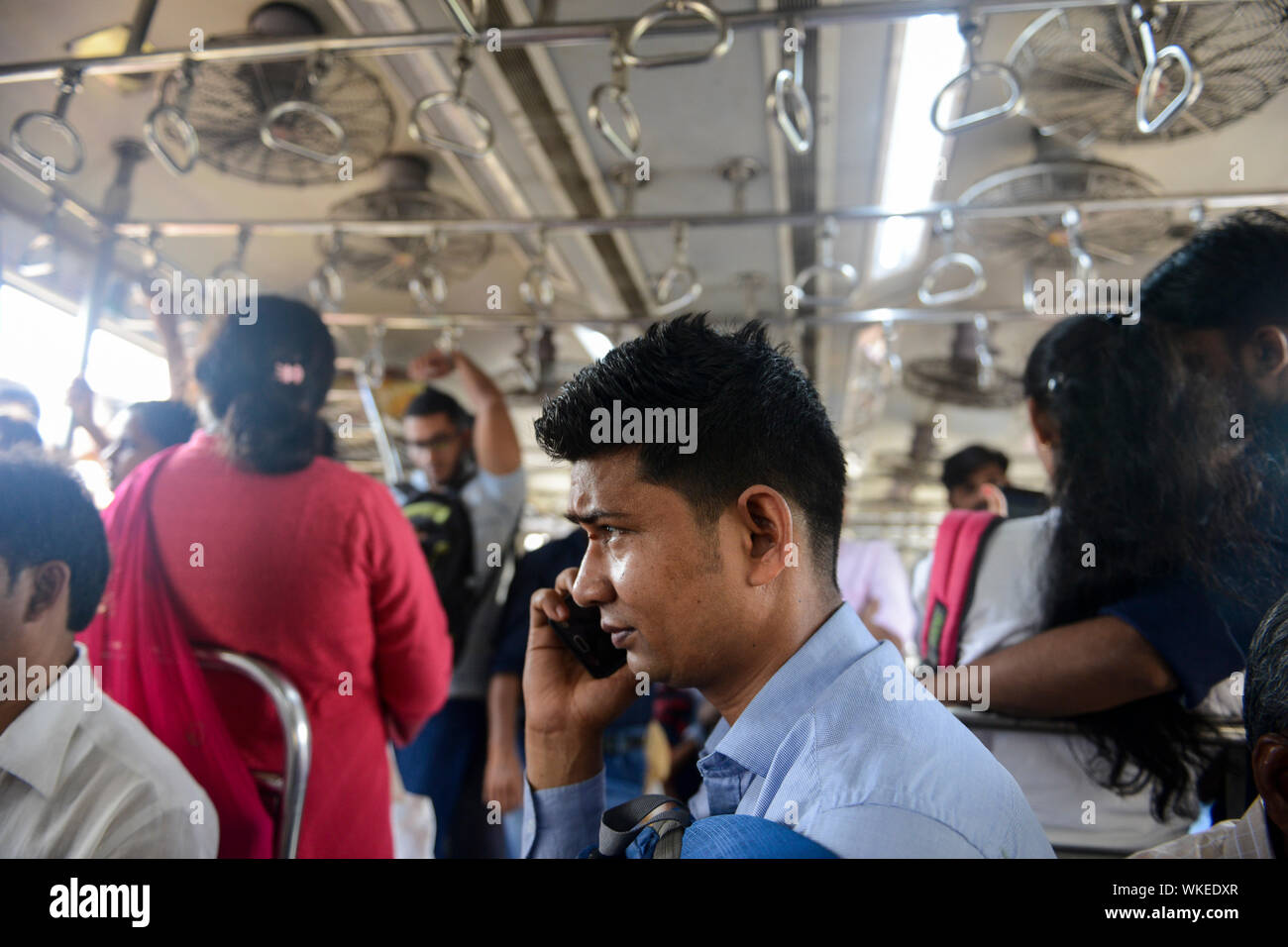 INDIA, Mumbai, inside suburban train Western Railway WR, commuter travel between suburbans and city centre Stock Photo