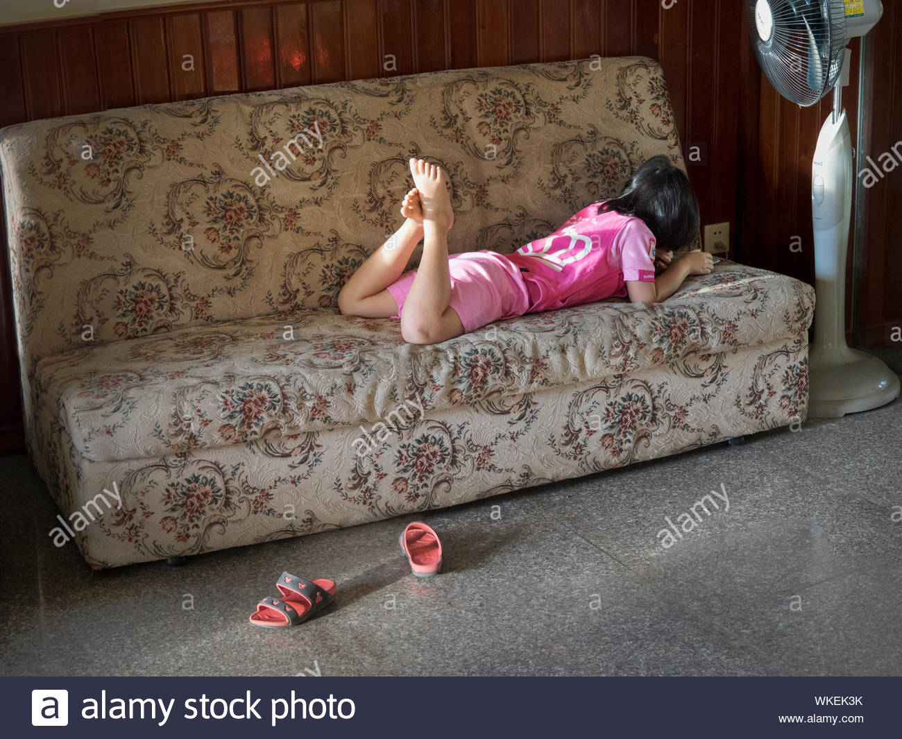 Barefoot Girl Lying On Couch Stock Photos & Barefoot Girl Lying On