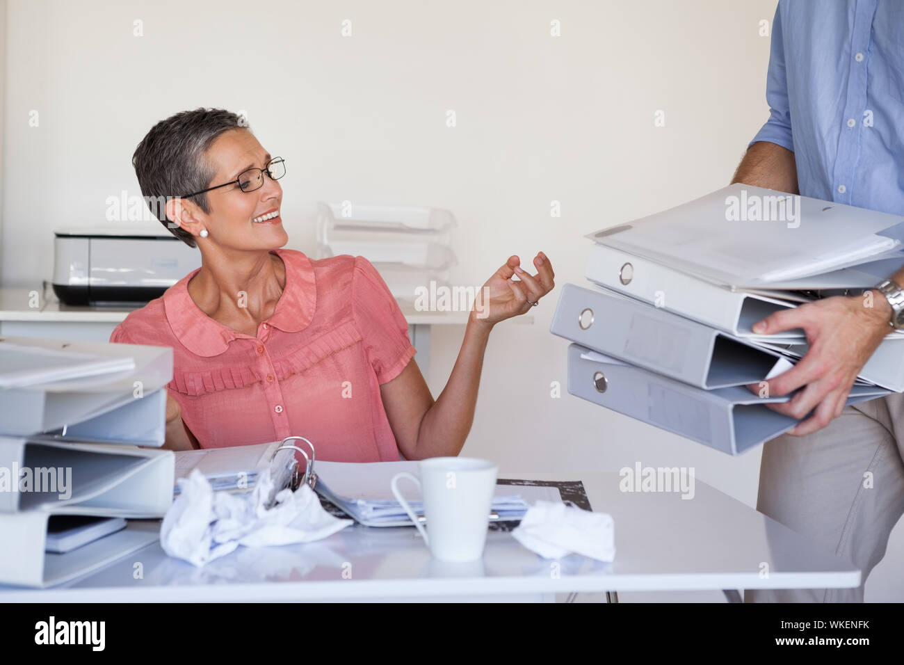 Casual businesswomans workload getting bigger and bigger in the office