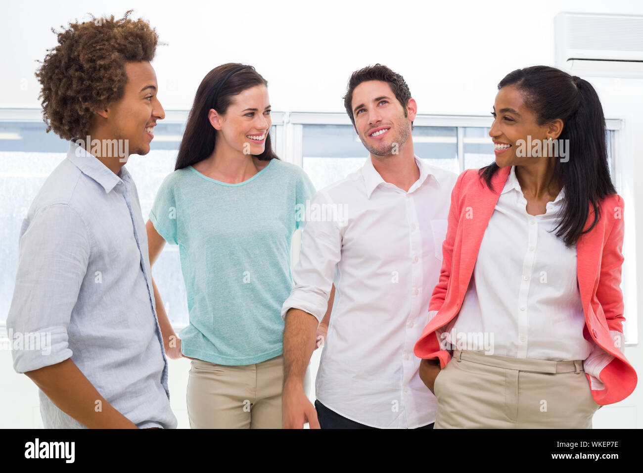 Casual workers communicating and interacting in the office Stock Photo