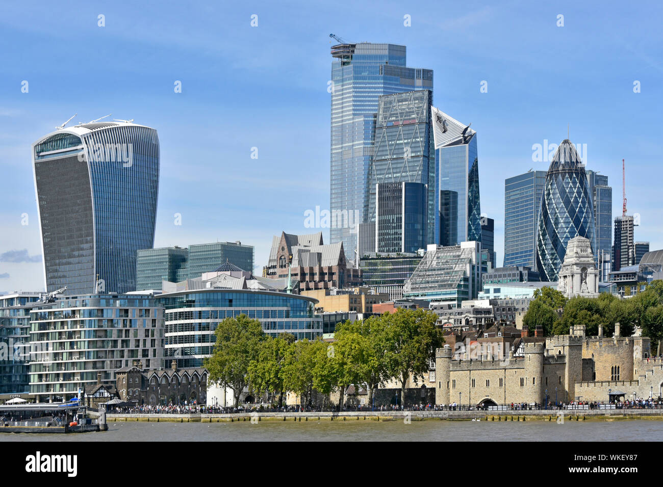 Tower of London dwarfed by skyline & cityscape of skyscraper building construction 2019 in city square mile financial district River Thames England UK Stock Photo