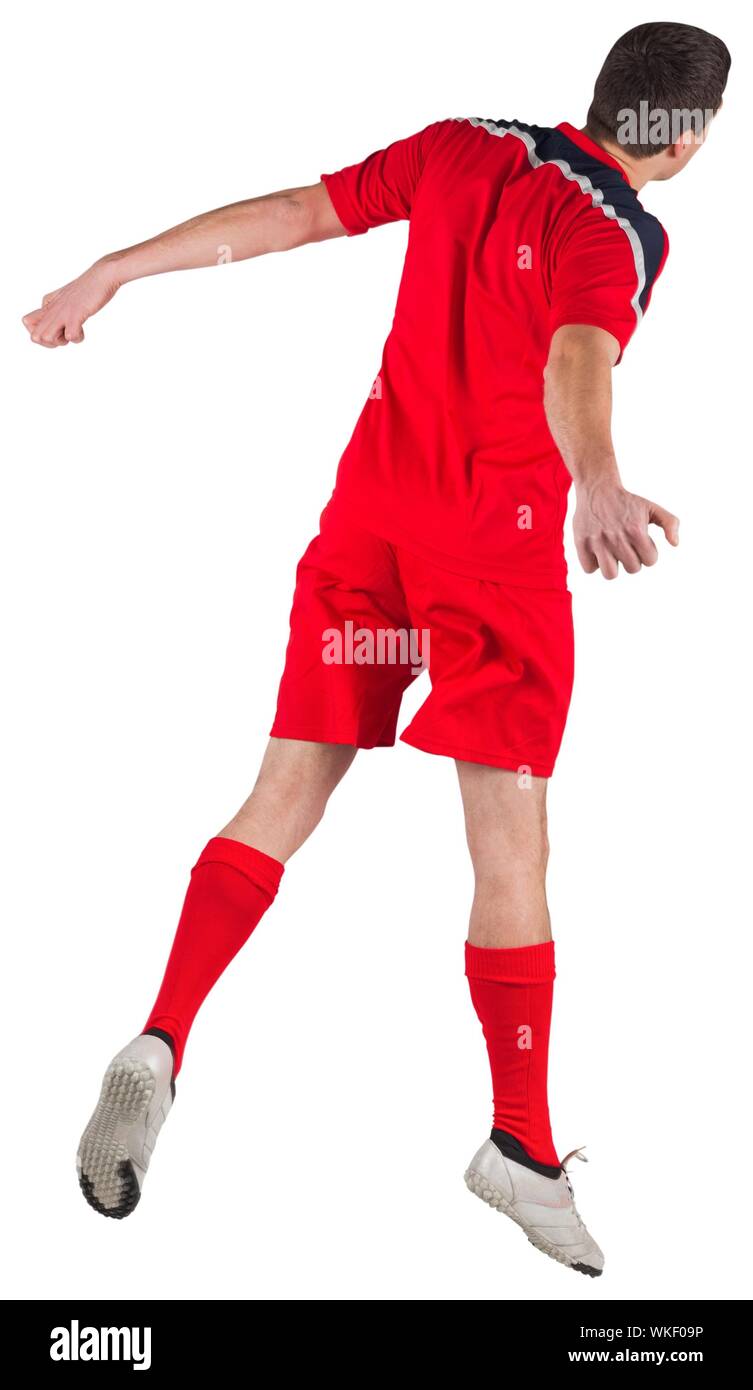 Fit football player jumping up on white background Stock Photo Alamy