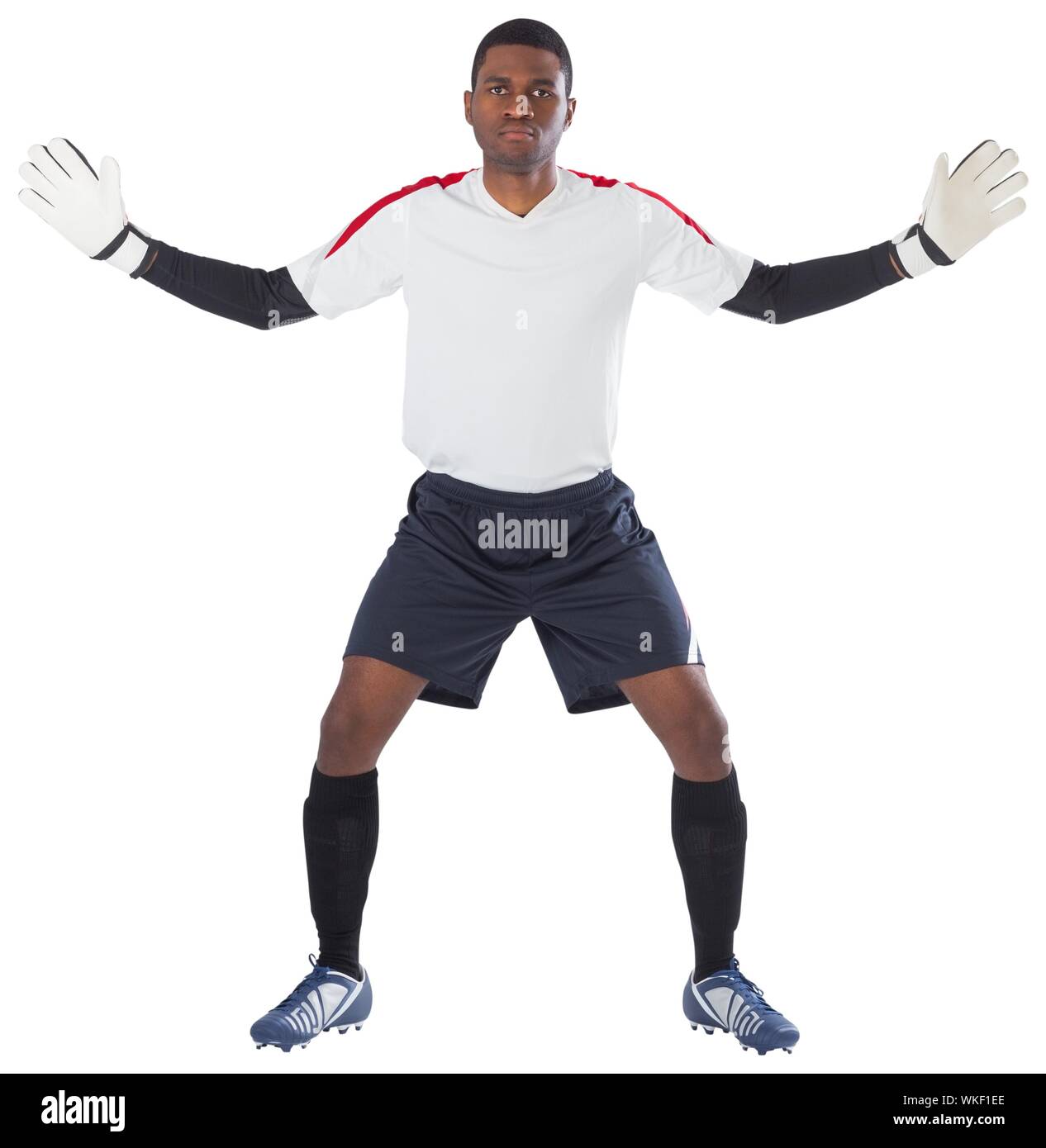 Goalkeeper in white ready to save on white background Stock Photo