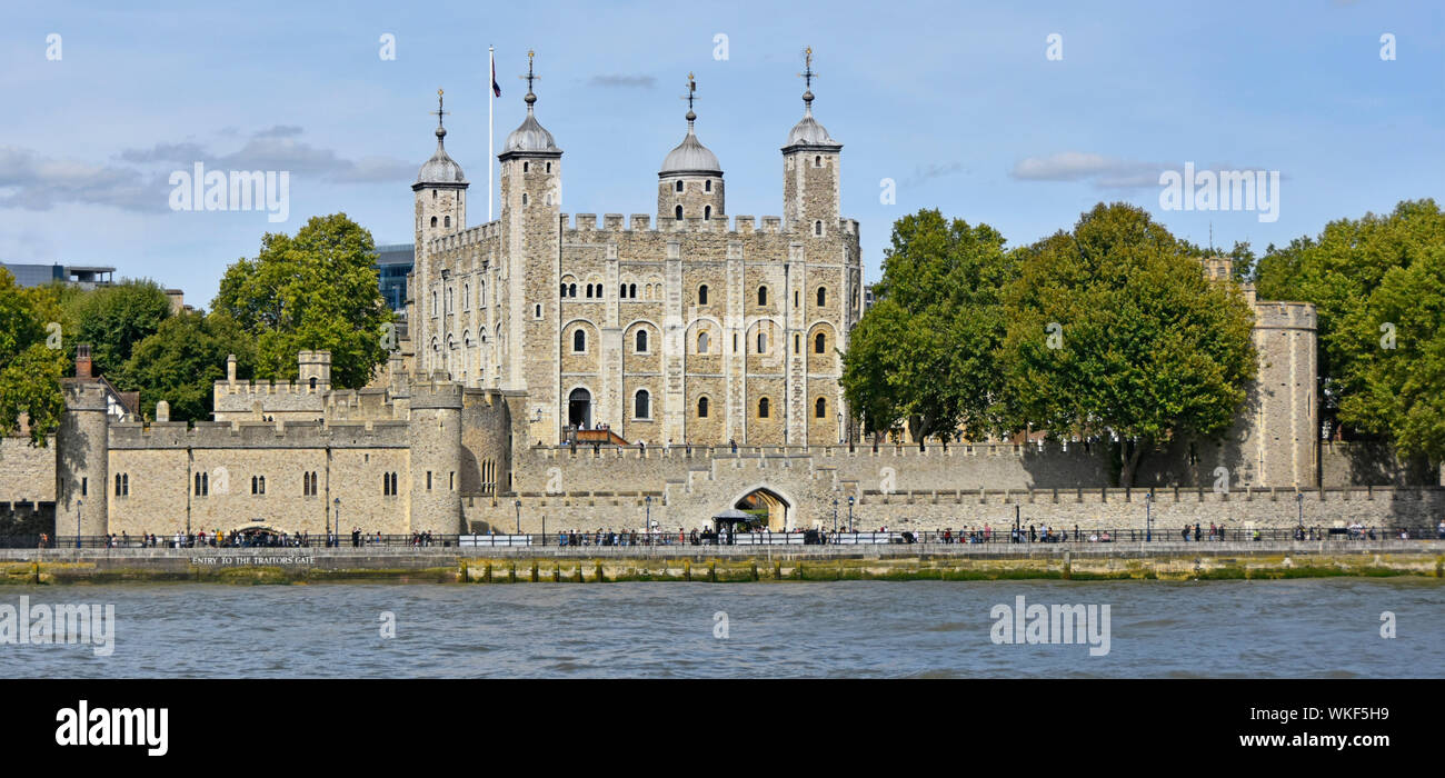 Panoramic view of iconic historical White Tower within Tower of London Royal Palace fortress & major tourism attraction beside River Thames England UK Stock Photo