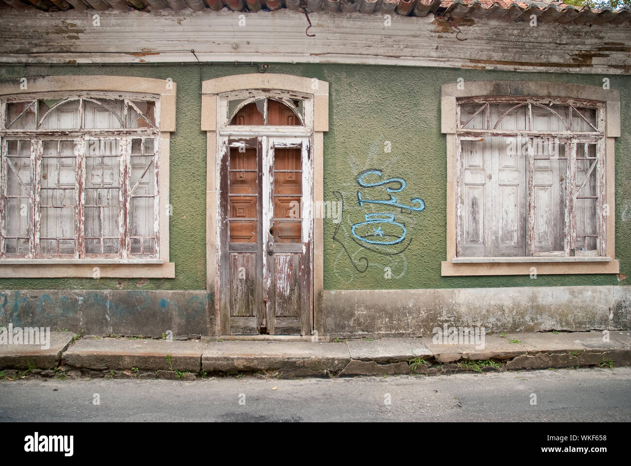 Old house facade with broken door and windows Stock Photo - Alamy