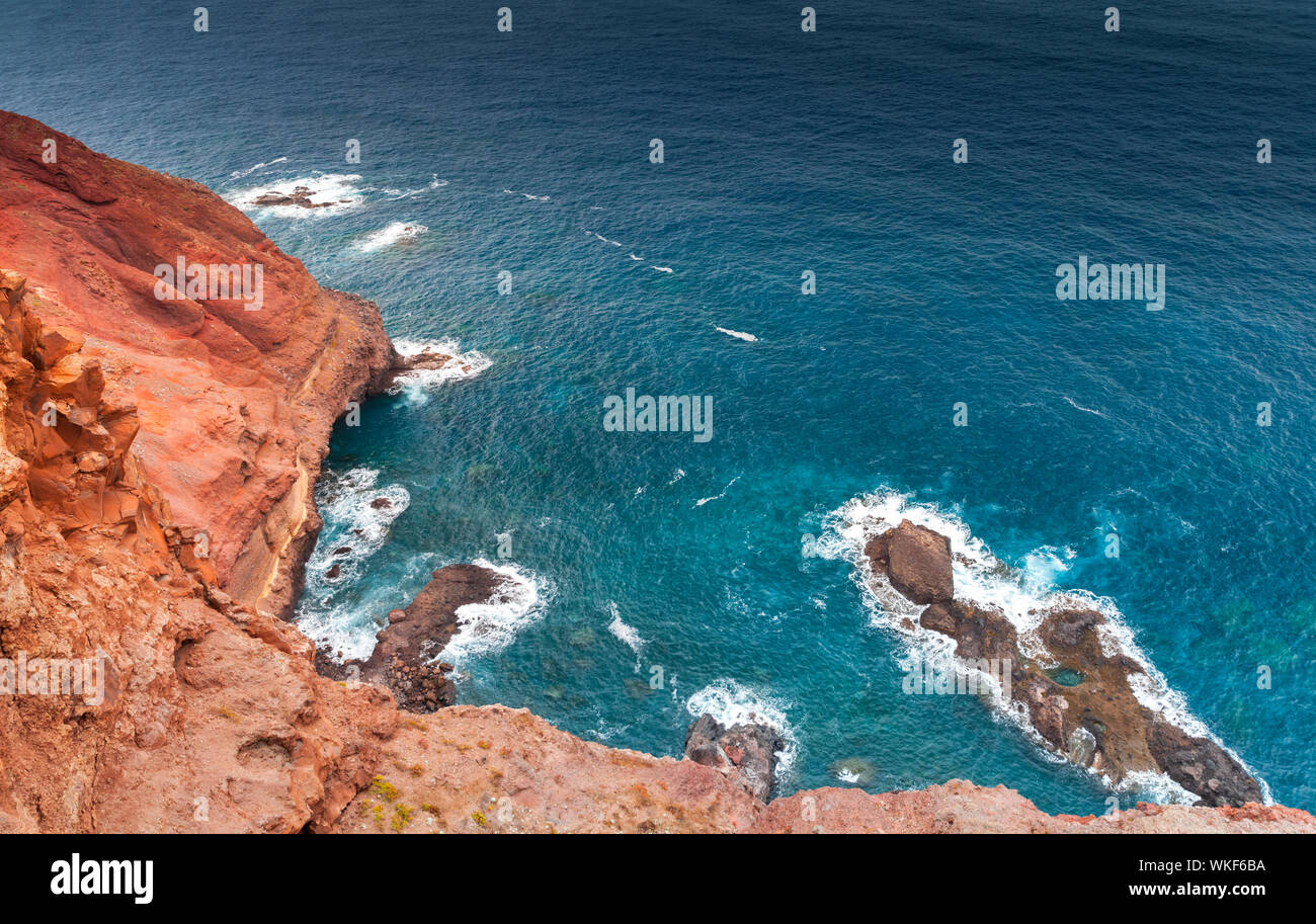 Red rocks and ocean surf at Ponta de Sao Lourenco, Madeira island, Portugal Stock Photo