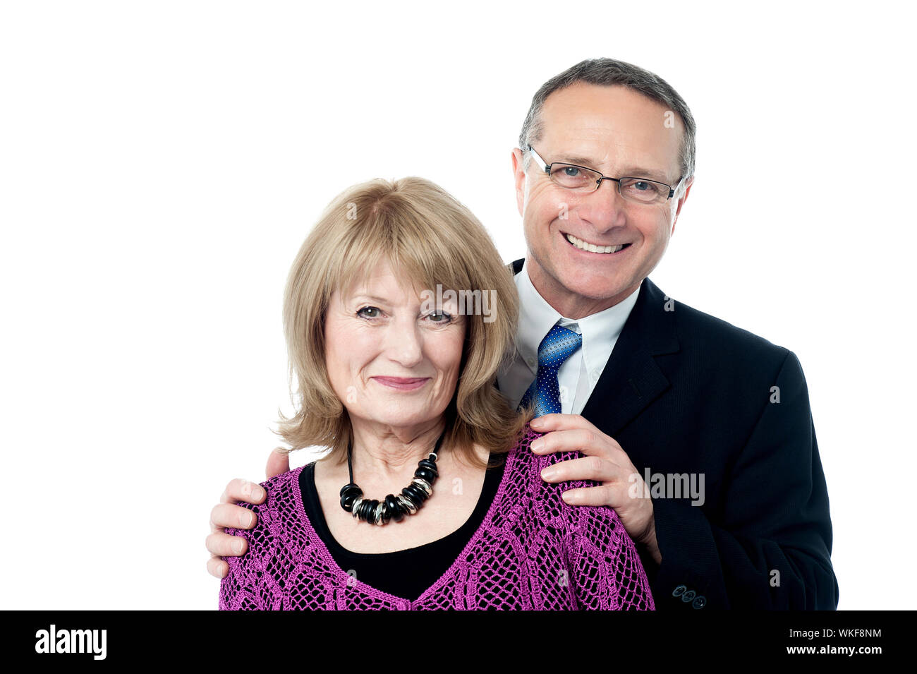 Loving senior couple posing over white background Stock Photo