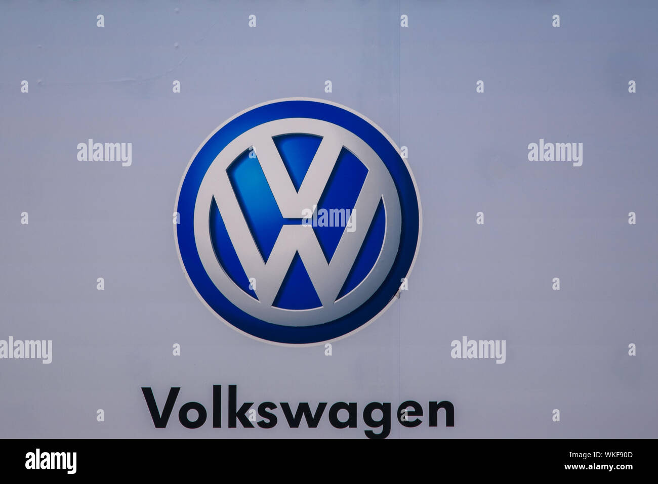 RIGA, LATVIA. 29th August 2019. Volkswagen company logo on facade of  car dealer service. Volkswagen is a german automaker - shortened VW. Stock Photo