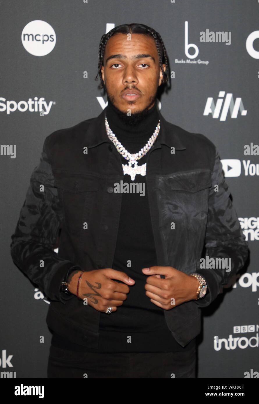 Rapper AJ Tracey on the red carpet arrivals board during the AIM Independent Music Awards 2019 held at the Roundhouse in London. Stock Photo